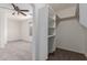 Bedroom with carpet flooring and storage shelves for organization and comfort at 3217 E Friess Dr, Phoenix, AZ 85032