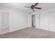 Bedroom with bathroom access, closet, and neutral carpet at 3217 E Friess Dr, Phoenix, AZ 85032