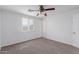 This bedroom features a bright window and modern ceiling fan at 3217 E Friess Dr, Phoenix, AZ 85032