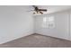 Bedroom features a bright window with neutral carpet and white walls at 3217 E Friess Dr, Phoenix, AZ 85032