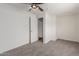 Bright bedroom with fresh carpet and a ceiling fan for added comfort and relaxation at 3217 E Friess Dr, Phoenix, AZ 85032