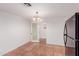 This dining room boasts tile flooring and a modern chandelier for stylish meals at 3217 E Friess Dr, Phoenix, AZ 85032