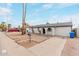 Charming single-story home featuring desert landscaping and well-maintained sidewalks at 3217 E Friess Dr, Phoenix, AZ 85032