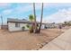 Charming single-story home featuring desert landscaping and well-maintained sidewalks at 3217 E Friess Dr, Phoenix, AZ 85032