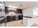 Functional kitchen with stainless steel appliances and tiled backsplash for cooking convenience at 3217 E Friess Dr, Phoenix, AZ 85032