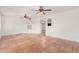 Spacious living room with tile flooring, neutral walls, and arched doorways leading to other rooms at 3217 E Friess Dr, Phoenix, AZ 85032