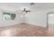 Bright living room with tile flooring, neutral walls, and a large window for natural light at 3217 E Friess Dr, Phoenix, AZ 85032