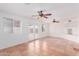 Spacious living room with tile flooring, neutral walls, and glass doors leading outside at 3217 E Friess Dr, Phoenix, AZ 85032