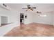 Spacious living room features neutral walls, tile floors, and ceiling fans for comfortable living at 3217 E Friess Dr, Phoenix, AZ 85032