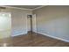 A vacant bedroom featuring light brown walls, and a closet with an open door at 349 E Thomas Rd # E402, Phoenix, AZ 85012