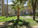 Well-maintained community grounds with mature trees and landscaping at 349 E Thomas Rd # E402, Phoenix, AZ 85012