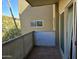 An exterior view of a patio, showing the patio floor and a view of the sky and trees at 349 E Thomas Rd # E402, Phoenix, AZ 85012