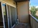 A patio featuring sliding glass doors, and an exterior view of trees and the sky at 349 E Thomas Rd # E402, Phoenix, AZ 85012