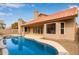 Backyard pool area with lush landscaping and a patio at 4129 E Nighthawk Way, Phoenix, AZ 85048