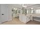 Bright bathroom featuring double sinks, ample mirror space, and white cabinets at 4129 E Nighthawk Way, Phoenix, AZ 85048