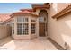 Home entrance featuring a red-tiled porch and a decorative turret at 4129 E Nighthawk Way, Phoenix, AZ 85048