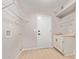 Laundry room with overhead shelving, sink, and light wood floors at 4129 E Nighthawk Way, Phoenix, AZ 85048