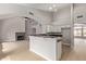 Spacious open-concept living area flows into kitchen with granite countertops and breakfast bar at 4129 E Nighthawk Way, Phoenix, AZ 85048