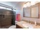 Renovated bathroom featuring a walk-in shower, granite countertop and modern light fixtures at 4325 E Sacaton St, Phoenix, AZ 85044