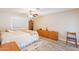 Inviting bedroom with light-colored walls, a ceiling fan, and a view of the neighborhood at 4325 E Sacaton St, Phoenix, AZ 85044