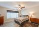 Nice bedroom with ample natural light, a ceiling fan, and neutral decor to relax and enjoy at 4325 E Sacaton St, Phoenix, AZ 85044