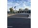Exterior of the Ahwatukee Recreation Center with flags and ample parking at 4325 E Sacaton St, Phoenix, AZ 85044