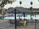 Community pool featuring a shaded lounging area with tables and chairs at 4325 E Sacaton St, Phoenix, AZ 85044
