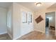 Entryway of the house with double white doors and light wood flooring at 4325 E Sacaton St, Phoenix, AZ 85044