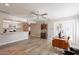 Open-concept living area with a seamless flow between the kitchen and a cozy seating area at 4325 E Sacaton St, Phoenix, AZ 85044