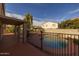Relaxing backyard with covered patio and fenced pool, perfect for entertaining at 43646 W Elizabeth Ave, Maricopa, AZ 85138