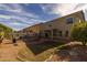 Spacious backyard with a pool, patio, and low-maintenance landscaping at 43646 W Elizabeth Ave, Maricopa, AZ 85138