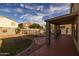 Backyard features a covered patio and a fenced pool for outdoor enjoyment at 43646 W Elizabeth Ave, Maricopa, AZ 85138