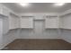 Walk-in closet with built-in shelving and ample storage space at 43646 W Elizabeth Ave, Maricopa, AZ 85138