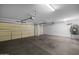 Spacious three-car garage with ample room for storage and parking at 43646 W Elizabeth Ave, Maricopa, AZ 85138