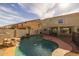 Backyard showcasing a lovely private pool and patio area for relaxation at 43646 W Elizabeth Ave, Maricopa, AZ 85138