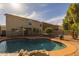 Inviting backyard with pool and patio, ideal for outdoor living at 43646 W Elizabeth Ave, Maricopa, AZ 85138