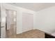 Bedroom featuring tiled floors, natural light, closet, and neutral paint at 43868 W Colby Dr, Maricopa, AZ 85138