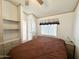 Cozy bedroom with built-in shelves, comfortable bedding, and good natural light at 455 S Jaspar Dr, Apache Junction, AZ 85119