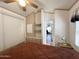 The spacious bedroom boasts built-in storage and a comforting ceiling fan at 455 S Jaspar Dr, Apache Junction, AZ 85119