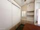 Bright bedroom features built in shelving, cabinets, closet, and a cozy atmosphere at 455 S Jaspar Dr, Apache Junction, AZ 85119