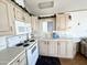 Efficient kitchen layout with ample cabinet storage and countertop space at 455 S Jaspar Dr, Apache Junction, AZ 85119