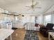 Open living space with updated kitchen, comfortable seating, and ceiling fan at 455 S Jaspar Dr, Apache Junction, AZ 85119