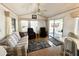 Bright living room featuring wood floors, ceiling fan, and comfortable seating at 455 S Jaspar Dr, Apache Junction, AZ 85119