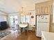 Open floor plan: dining area, access to the outdoors, and kitchen appliances at 455 S Jaspar Dr, Apache Junction, AZ 85119