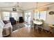 Open living area with sliding glass doors, dining area, and relaxing chairs at 455 S Jaspar Dr, Apache Junction, AZ 85119