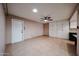 Spacious bedroom with tile flooring, neutral paint, ceiling fan and closet at 4916 E Hopi St, Phoenix, AZ 85044