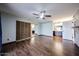 Large bedroom with wood floors, ceiling fan and a walk-in closet with mirrored doors at 4916 E Hopi St, Phoenix, AZ 85044