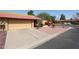 Charming single-story home with a well-maintained yard, attached garage, and vibrant landscaping at 4916 E Hopi St, Phoenix, AZ 85044