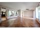 Bright living room with tiled floors, ceiling fan and large windows at 4916 E Hopi St, Phoenix, AZ 85044