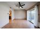Bright living area featuring tiled floors, ceiling fan and sliding glass doors at 4916 E Hopi St, Phoenix, AZ 85044